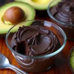 creamy avocado chocolate mousse no sugar topped with raspberries