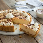 Dolly Parton peanut butter pie slice with whipped topping
