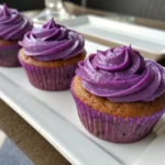 Ube cupcakes with purple frosting served fresh