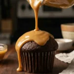 pouring-silky-peanut-butter-ganache-glaze-on-cupcake (1)
